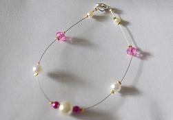 Bracelet en perle de verre tchèque fuchsia et blanche et toupie